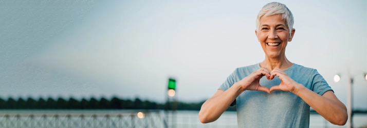 Chiropractic Warner Robins GA Happy Woman With Heart Hands